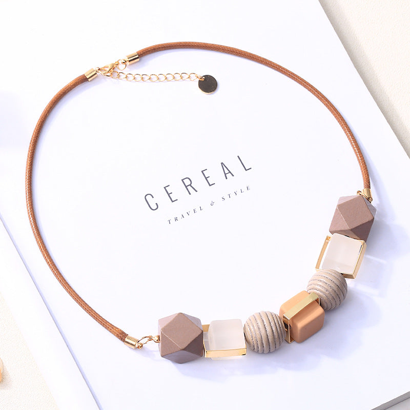 Elevate Your Accessories Game with a Colored Wood Pendant Necklace